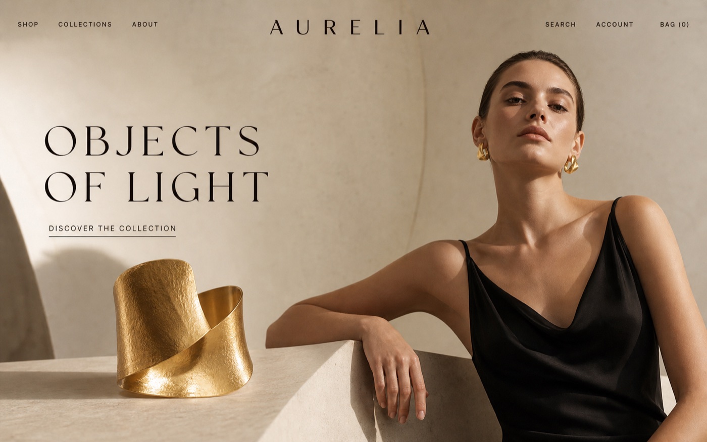 Aurelia jewelry homepage featuring a sculptural gold cuff and luxury editorial photography